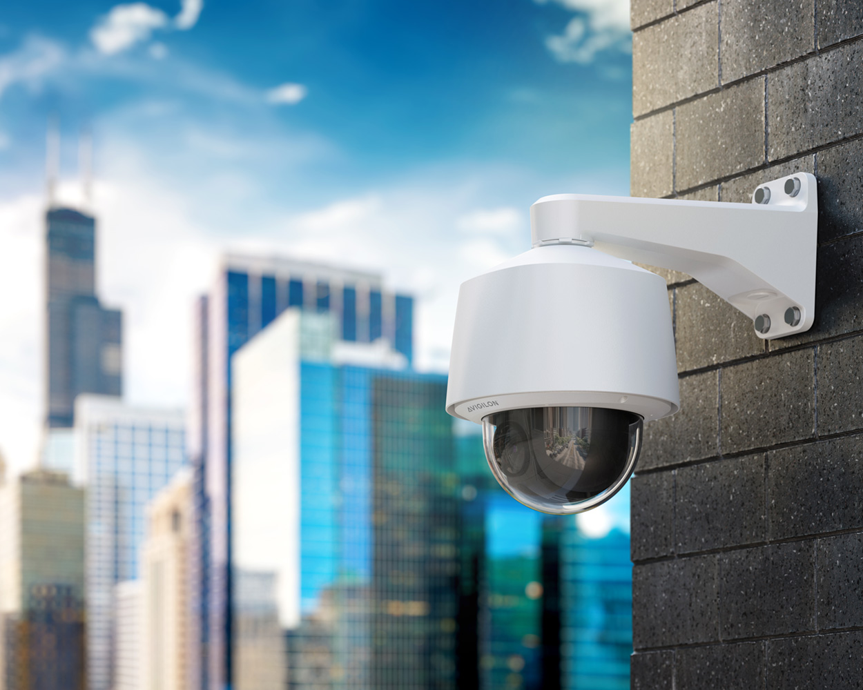 Avigilon commercial PTZ camera overlooking a city skyline